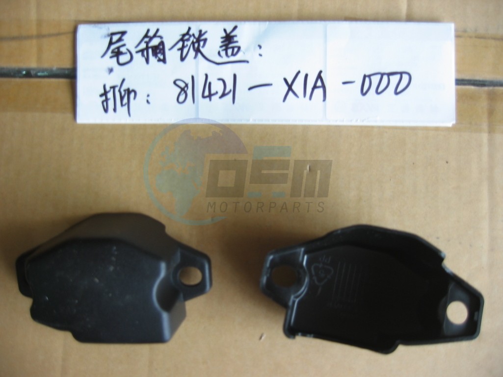 Product image: Sym - 81421-X1A-000 - TRUNK BOX LOCK COVER  0
